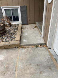 Cracked driveway before concrete repair in Chaska