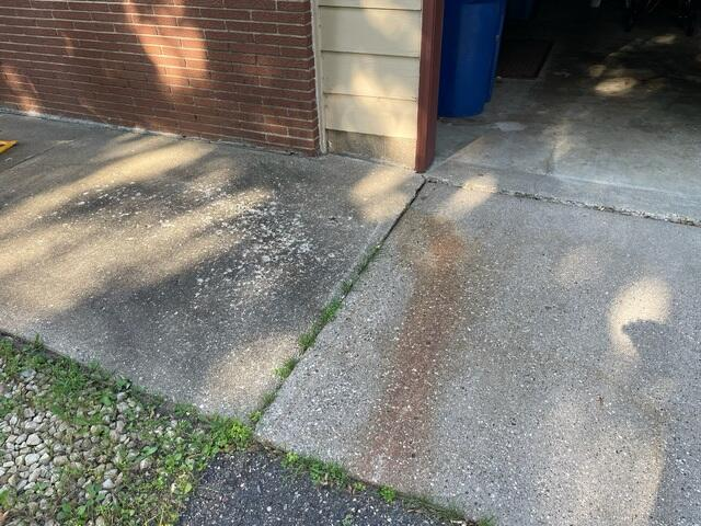 Uneven concrete pathway causing a tripping hazard in St. Cloud, MN before repair. Perfectly leveled and sealed concrete walkway in St. Cloud, MN after PolyLevel installation.