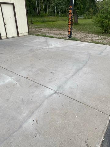 Leveled and fully stabilized concrete driveway with sealed cracks in Blackduck MN