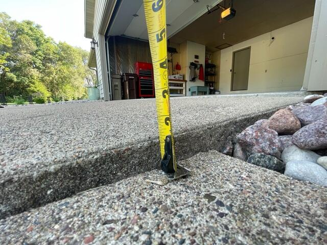 Close up view of uneven concrete surface showing leveling needs in Eau Claire WI