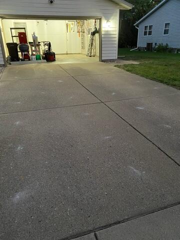 Sunken garage corner concrete slab before polyurethane foam lifting in Eau Claire WI