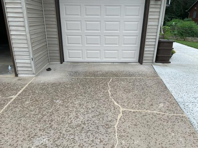 Uneven residential concrete sidewalk panel showing settlement cracking in Menomonie WI