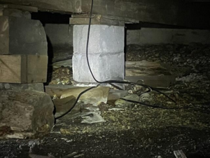 Moist crawl space before encapsulation in Ashland, WI