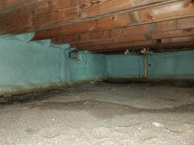 High performance green spray foam insulation applied uniformly along crawl space foundation walls near Tamarack Minnesota