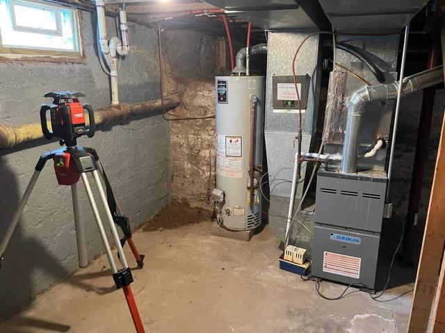 Unstable basement support area near the water heater before foundation repair in Dresser Wisconsin