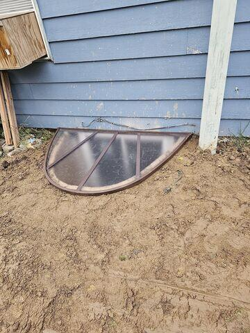 Completed exterior egress window installation with a cover in Remer MN